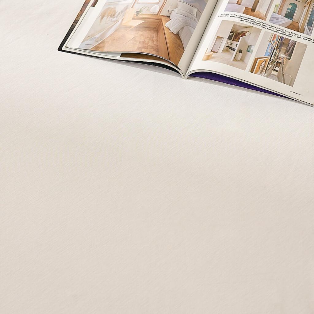 Hero image: Bảo vệ nệm Doona Tencel trên giường — thể hiện bề mặt mềm mát và lớp chống thấm.