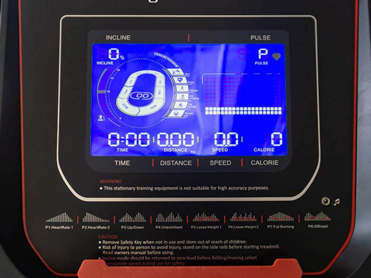 Hệ đệm giảm xóc và thảm Diamond bảo vệ khớp trên máy Oreni RE-6. ImagePrompt: Side view of treadmill deck showing multi-layer running belt and shock absorbers, family home interior, clear focus on cushioning system.
